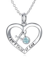 teensy silver cross baby December birthstone necklace